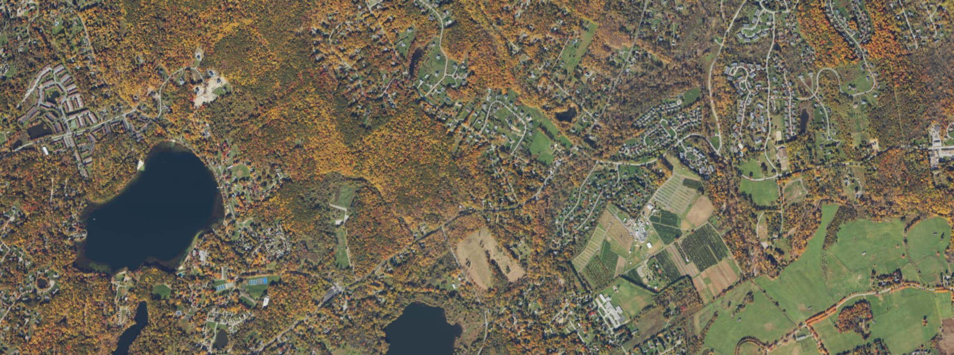 Aerial survey view over Beekman, NY, showing back roads, wooded lots and scattered farm fields